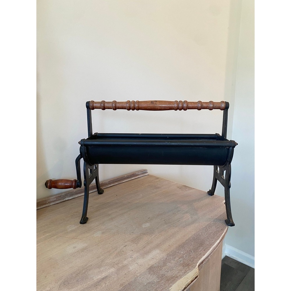 Vintage Cast Iron Newspaper Log Roller